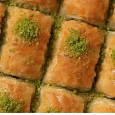 Close-up of baklava squares topped with crushed pistachio