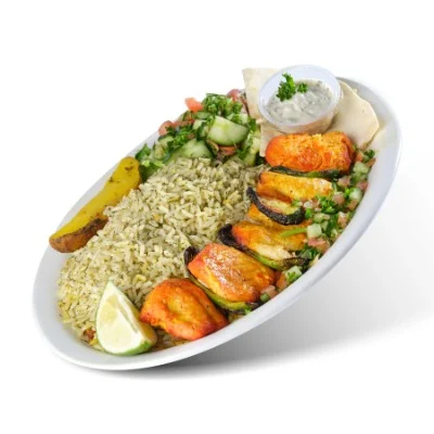 Grilled chicken kabob with dill rice, grilled tomatoes, salad and tzatziki