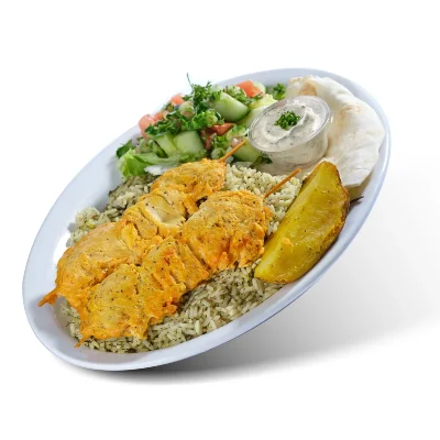 Chicken souvlaki on dill rice with salad, a potato wedge and tzatziki