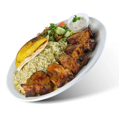 Grilled lamb chops with dill rice, salad, a potato wedge and tzatziki