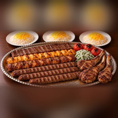 Persian kebab platter for three with barg, joojeh and koobideh kebabs, lamb chops, grilled tomatoes and three plates of saffron rice