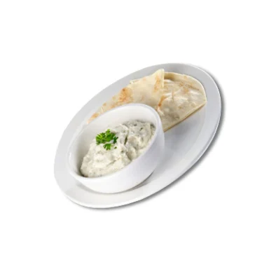 Bowl of tzatziki served with pita